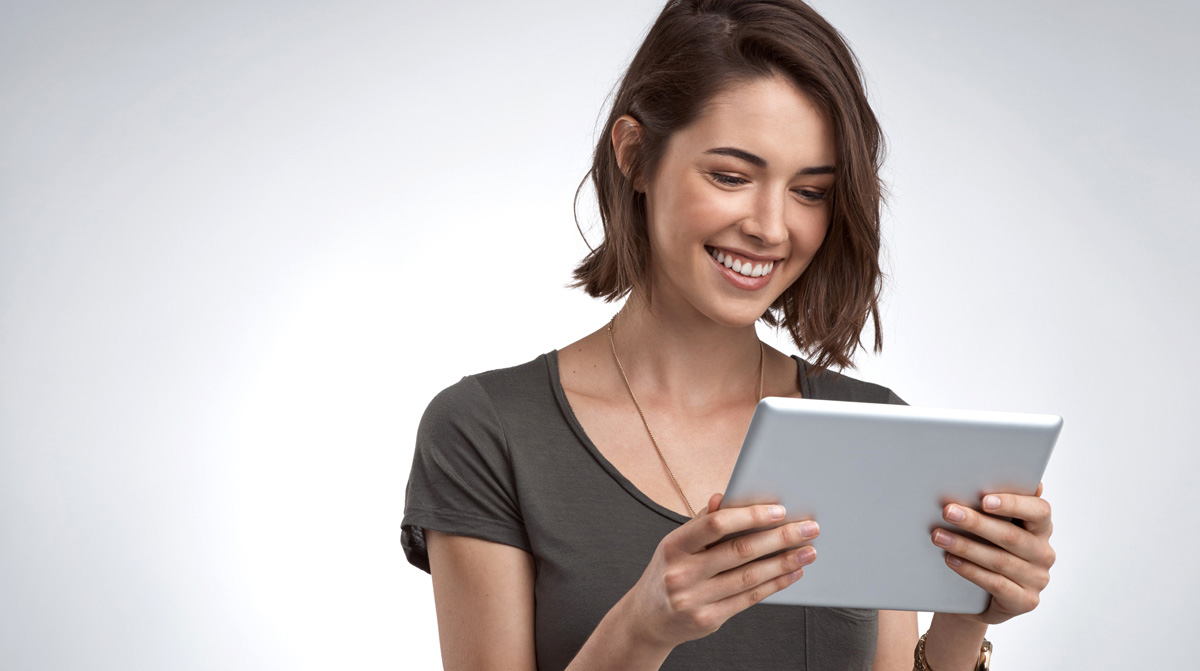 Photo of a woman using a tablet.
